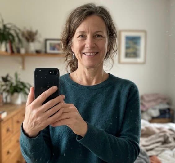 Nina taking a mirror selfie at home